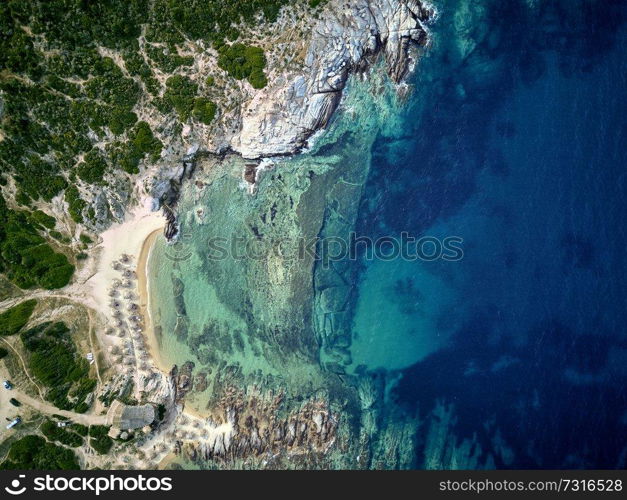 Beautiful beach and rocky coastline top aerial view drone shot, Sithonia, Greece