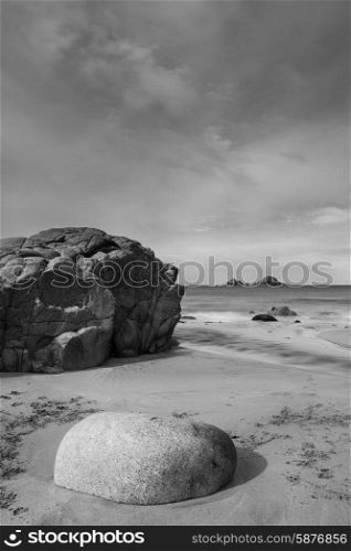 Beautiful beach landscape with pastel colors in morning light in black and white