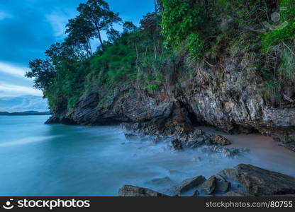 beautiful beach, rocks in the evening at sunset