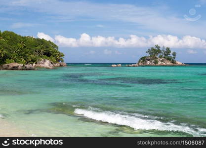 Beautiful beach with a small island in the near, Seychelles