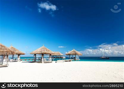 Beautiful beach with bungalow jetty at Maldives