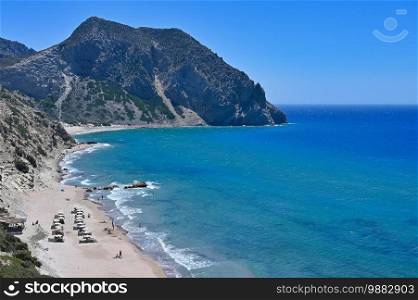 Beautiful beach with sea in tourist resort. Greece island Kos. Beautiful concept for summer vacation. Natural colorful background.