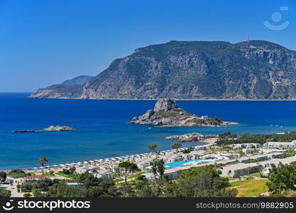 Beautiful beach with sea in tourist resort. Greece island Kos. Beautiful concept for summer vacation. Natural colorful background.