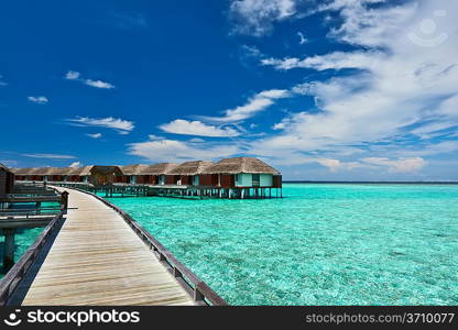 Beautiful beach with water bungalows at Maldives