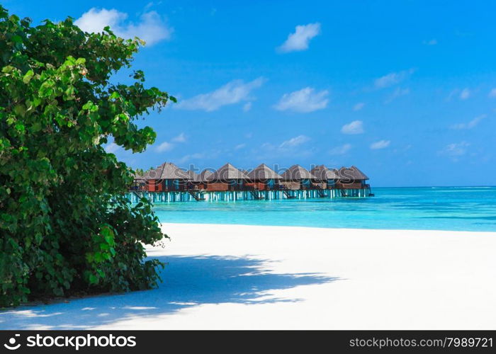 Beautiful beach with water bungalows at Maldives