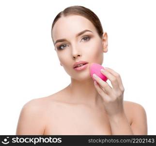Beautiful Beauty and face care concept - Beautiful Young Woman with Clean Fresh Skin using beauty egg isolated on white background. Beautiful Young Woman with Clean Fresh Skin using beauty egg isolated on white background