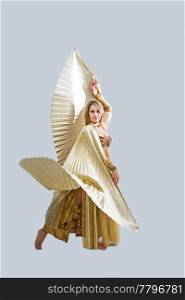 Beautiful belly dancer in gold outfit with wings, isolated