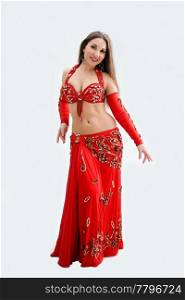 Beautiful belly dancer in red outfit, isolated