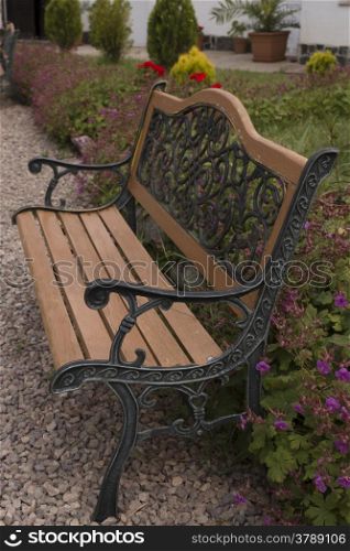 beautiful bench with ornaments in the garden