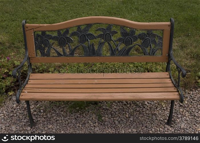 beautiful bench with ornaments in the garden