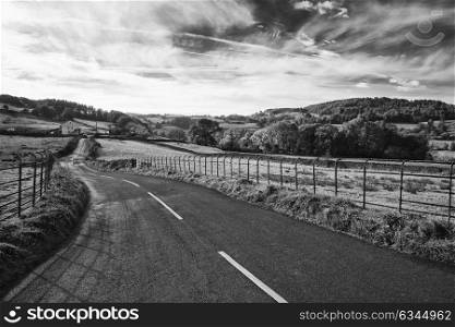 Beautiful black and white Autumn Fall landscape image of wide countryside in Lake District in England