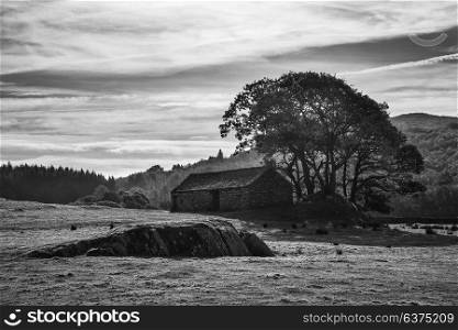Beautiful black and white Autumn Fall landscape image of wide countryside in Lake District in England