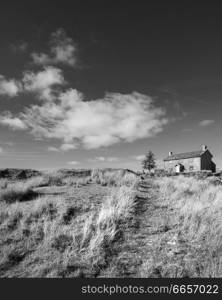 Beautiful black and white landscape image of Nun&rsquo;s Cross Farm in Dartmoor