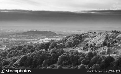 Beautiful black and white landscape image of view over English countryside during Summer sunset