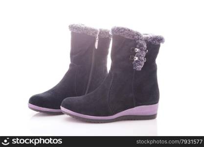 Beautiful, black boots with zips and buckles made of suede. On a white background.