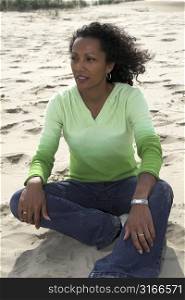 Beautiful black woman enjoying herself at the beach