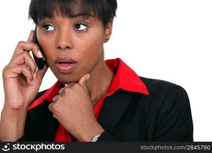 beautiful black woman making a call isolated on white