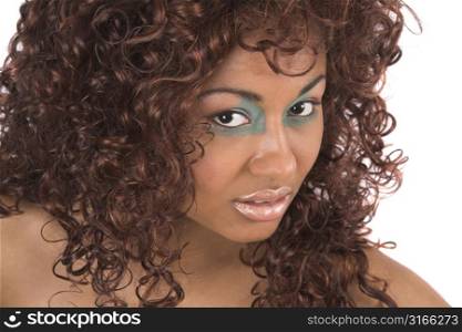 Beautiful black woman with long curly hair looking up