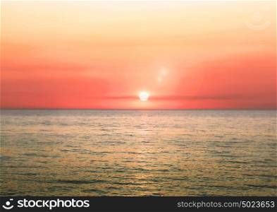 Beautiful blazing sunset landscape on a sea and sun