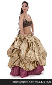 Beautiful blond belly dancer in golden costume dancing over white background