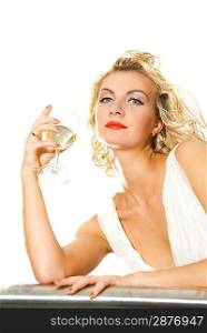 Beautiful blond girl with a glass of champagne isolated on white