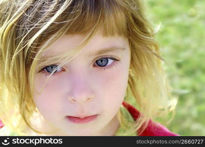 beautiful blond little girl children portrait outdoor in park