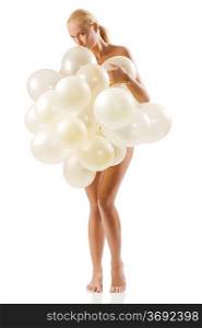beautiful blond woman covering her naked body with white air balloons and kissing them