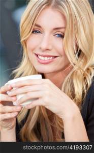 Beautiful Blond Woman Drinking Coffee