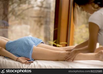 Beautiful blond woman enjoying a massage at the health spa