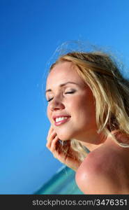 Beautiful blond woman having sun