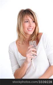 Beautiful blond woman holding glass of water