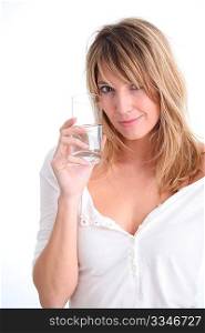 Beautiful blond woman holding glass of water