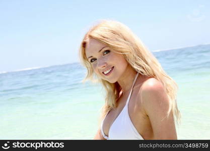 Beautiful blond woman in ocean water