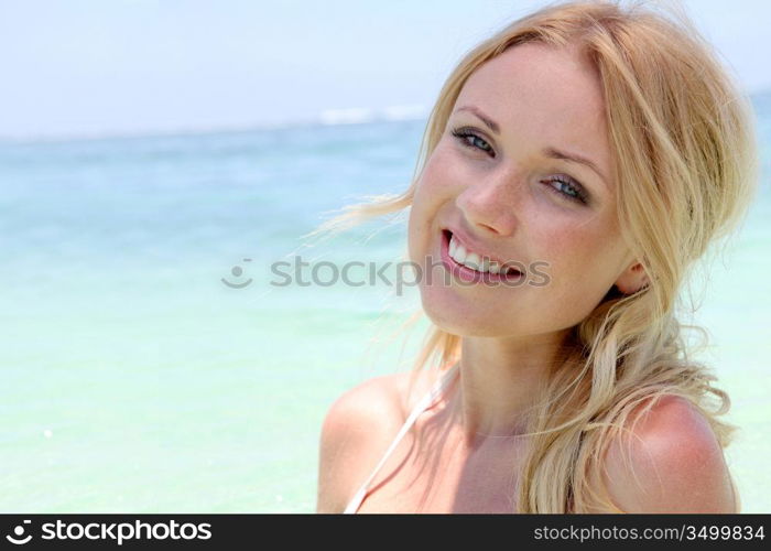 Beautiful blond woman in ocean water