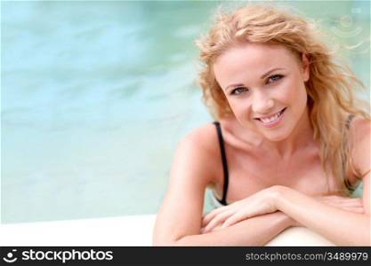 Beautiful blond woman in swimming pool