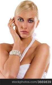 beautiful blond woman in white with silver bracelet jewellery and fashion make up isolated on white