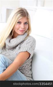 Beautiful blond woman realxing at home in winter