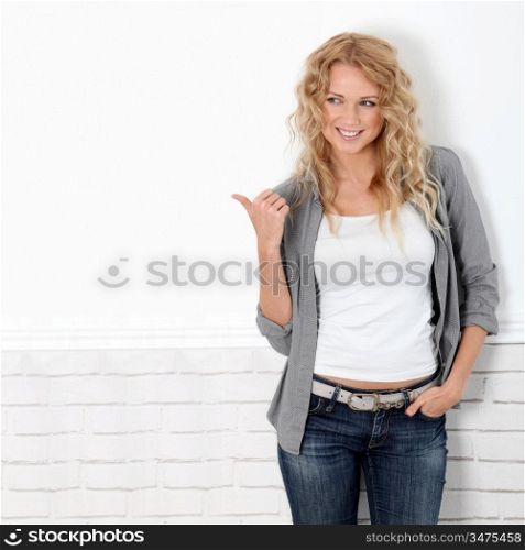 Beautiful blond woman showing thumb up