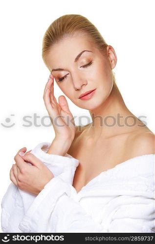 Beautiful blond woman touching her face
