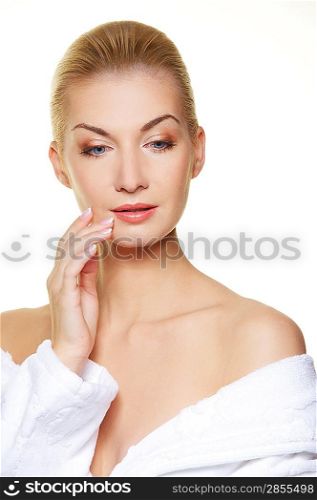 Beautiful blond woman touching her skin