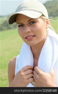 Beautiful blond woman with towel around her neck