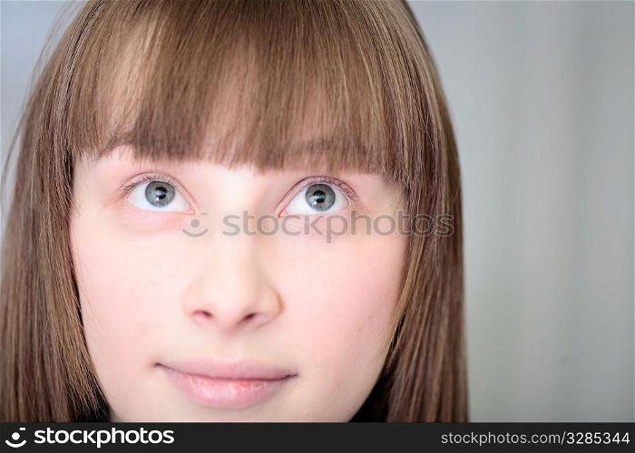 beautiful blond young woman close up half face