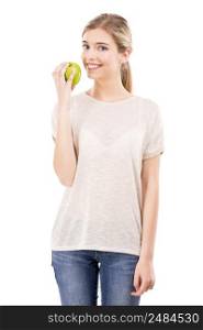 Beautiful blonde girl holding a green apple, over a white background