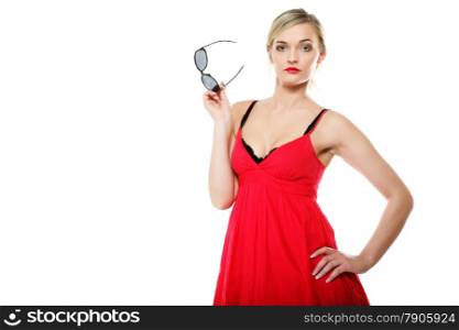 Beautiful blonde girl in red summer dress with sunglasses. Studio shot isolated on white background