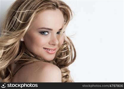 Beautiful blonde girl. Portrait of beautiful blonde girl with long curly hair