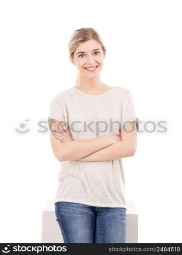 Beautiful blonde girl smiling and standing over a white background