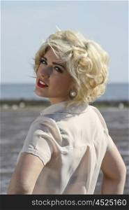 Beautiful blonde haired teenage girl who looks like Marilyn Monroe