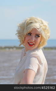 Beautiful blonde haired teenage girl who looks like Marilyn Monroe