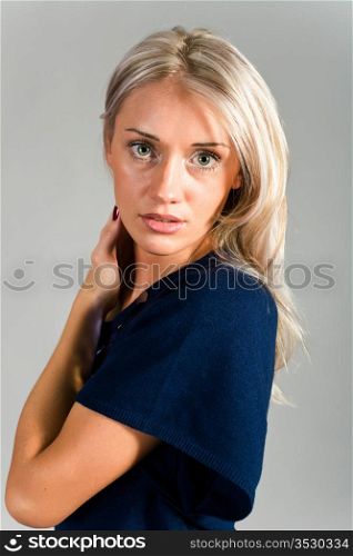beautiful blonde in an elegant dark blue dress
