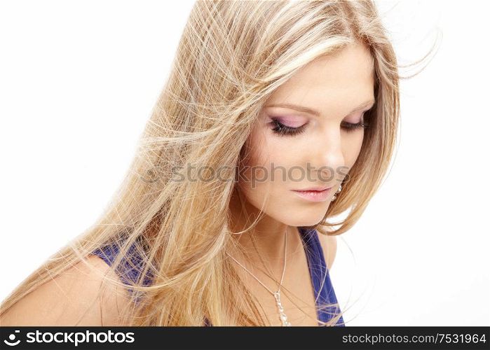 Beautiful blonde with a flying hair, isolated